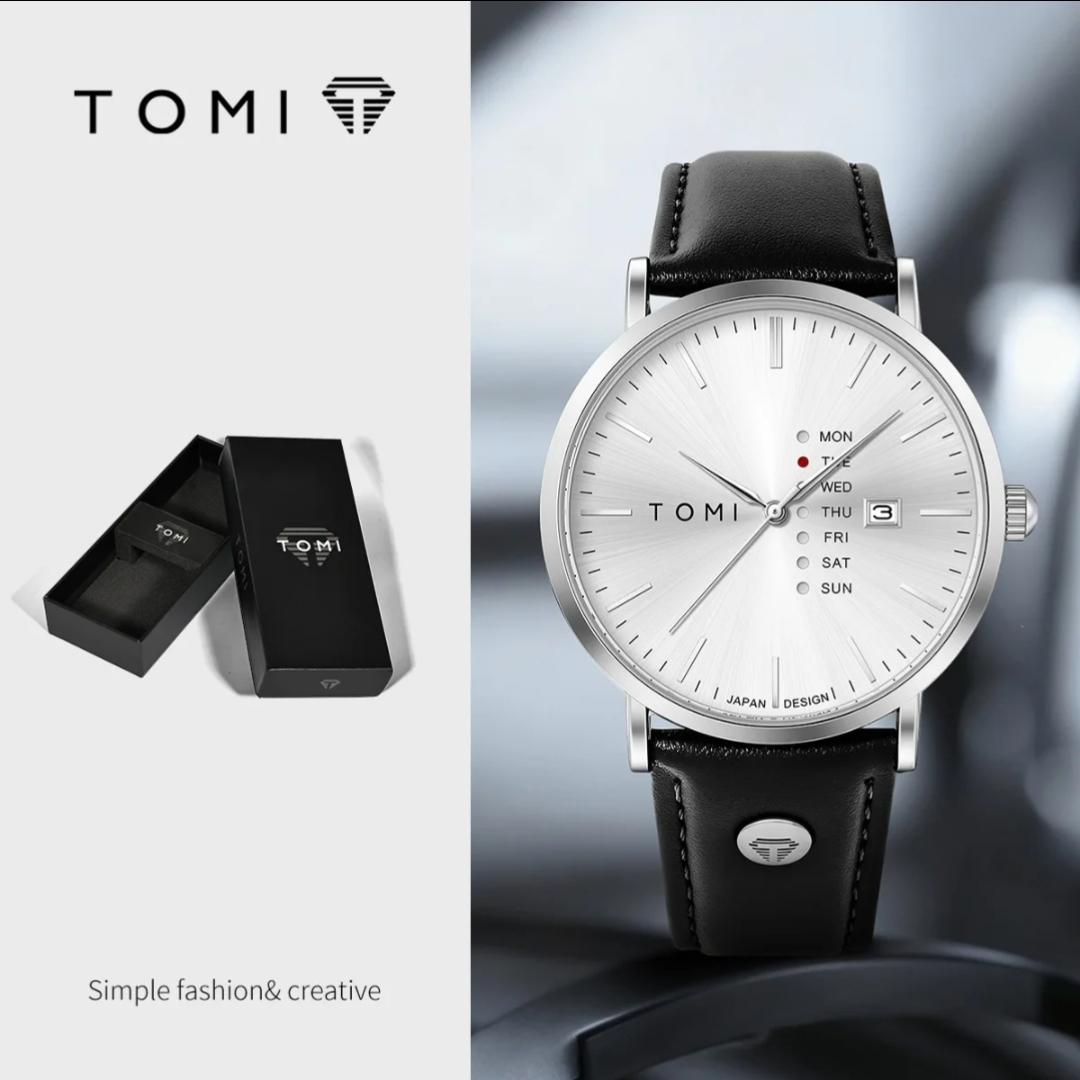 Montre TOMI à cadran blanc et bracelet en cuir noir avec son écrin noir ouvert